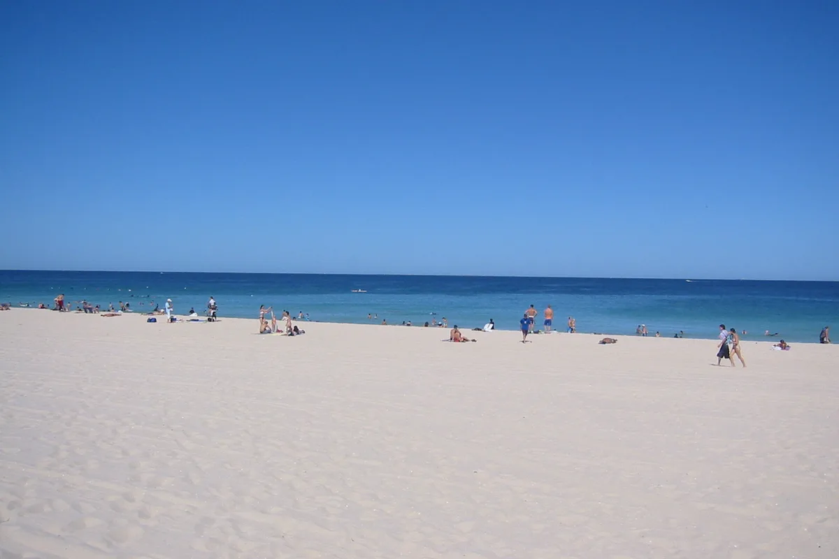 Wide sand and blue water at Scarborough Beach beside the Indian Ocean